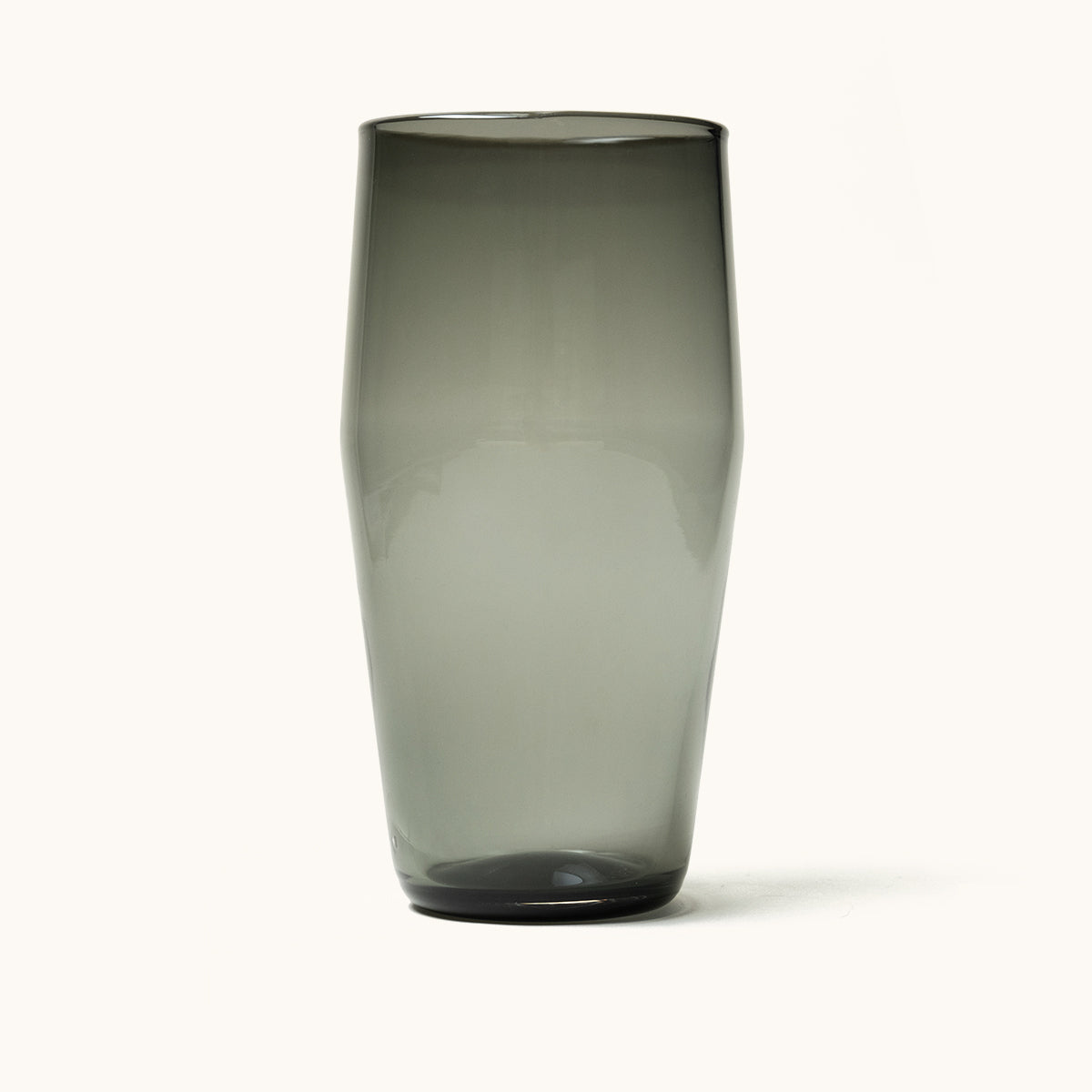Standard Pint Glass in translucent smoky grey, standing upright with a subtly flared shape.