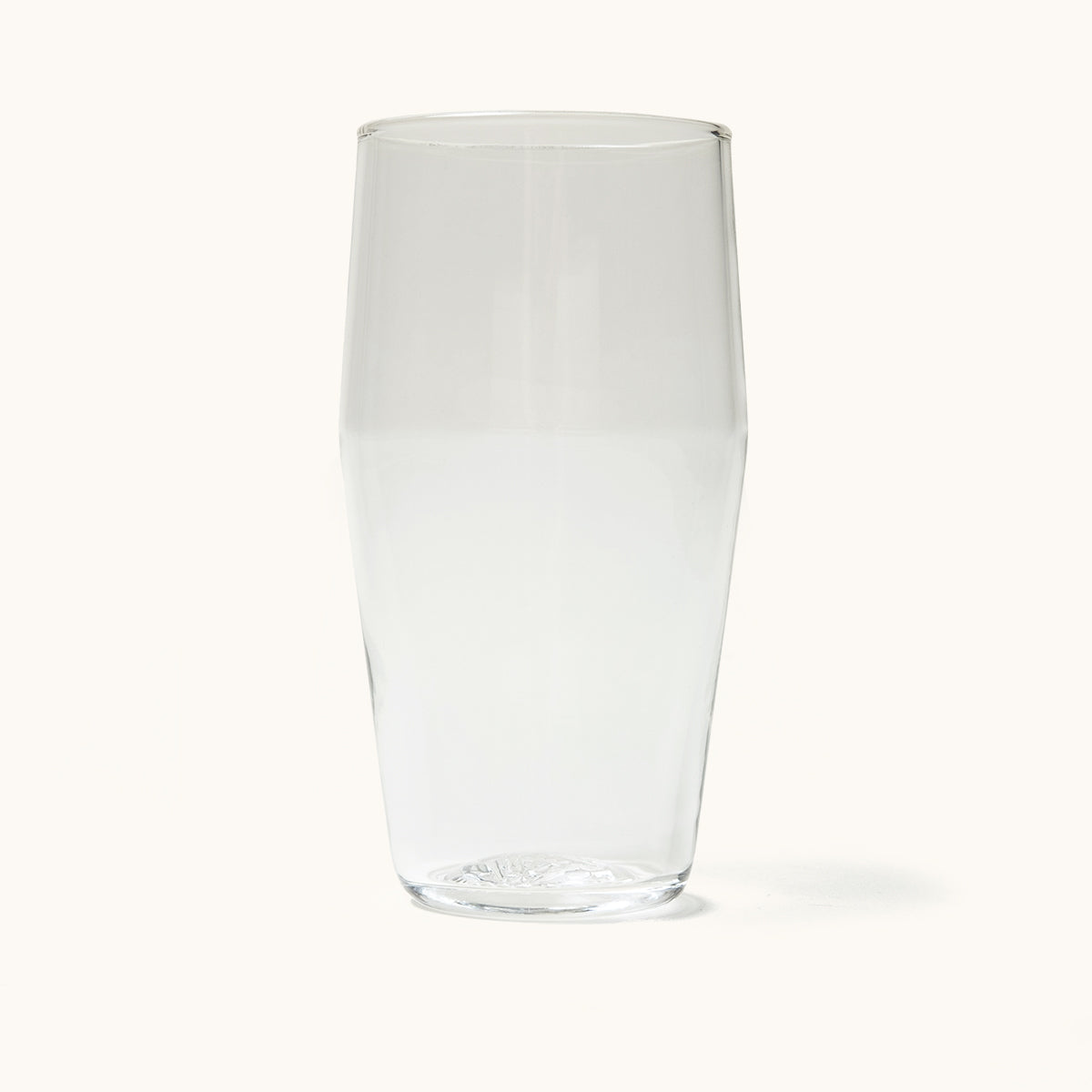 Clear glass Standard Pint Glass, slightly tapered with a wide mouth and subtle embossed detail on the base.
