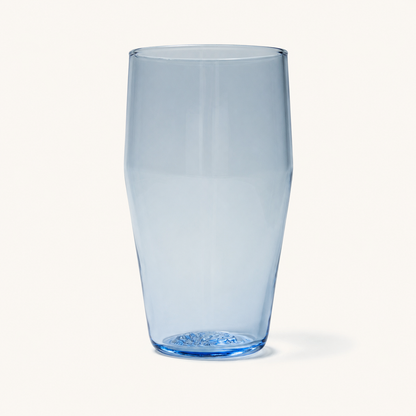 Clear standard pint glass with blue-tinted base and textured bottom, shown front view on white background