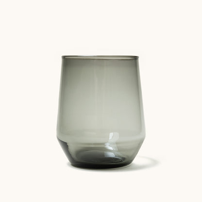 Dark gray stemless wine glass with a gently tapered form and subtle reflections.