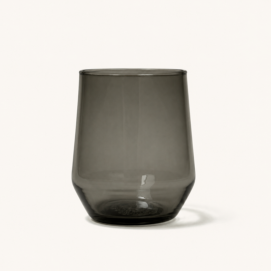 Smoky gray stemless wine glass with textured base, front view, clear glass material, minimalist design