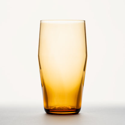 Amber glass standard pint with a thick base, shown upright against a plain white background.