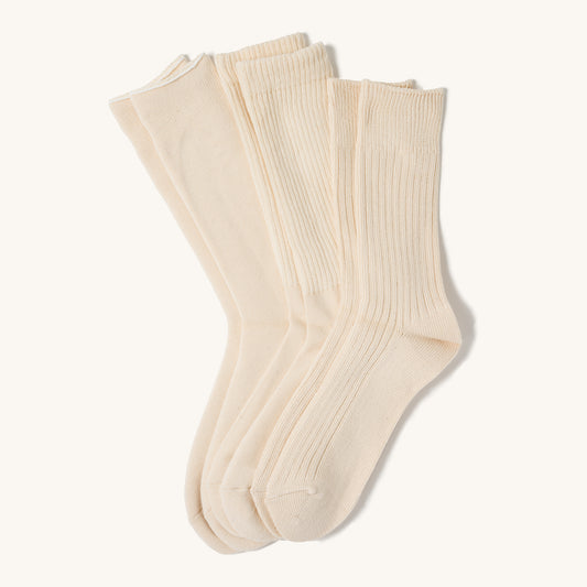 Ecru crew socks in a 3-pack with ribbed cuffs, displayed side-by-side on a plain white background.