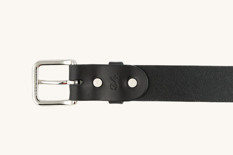 Black leather Daily Belt with a silver-toned rectangular buckle, two rivets, and an embossed '34' size mark.