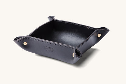 Black leather valet tray by TANNER GOODS, with gold-tone snaps.